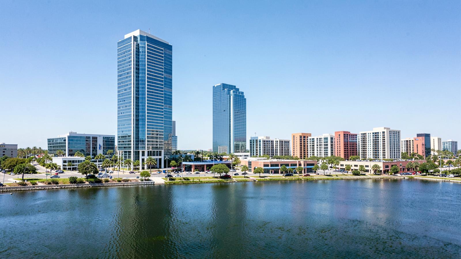 Office towers reflected in a lake in a North Texas business district