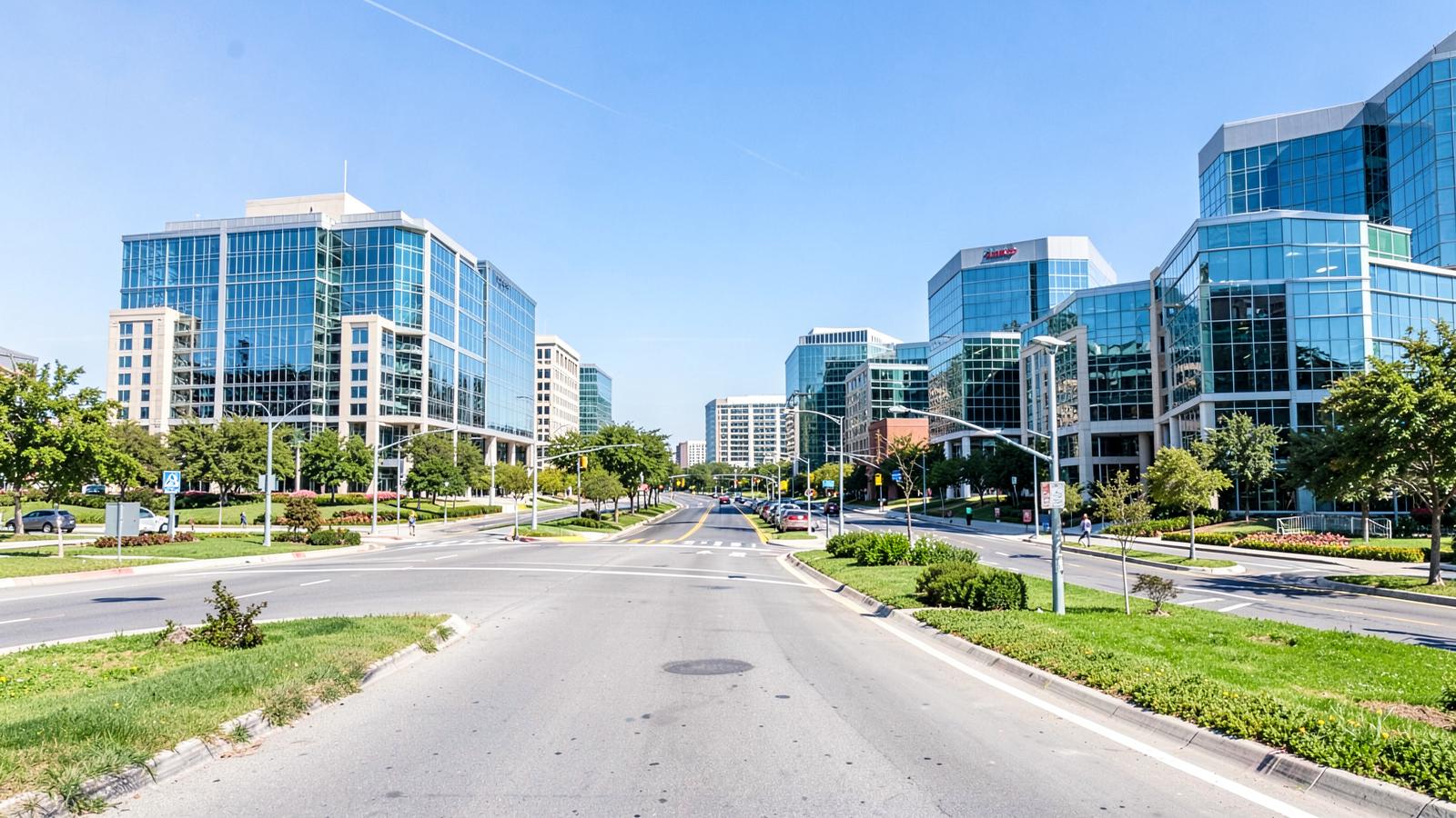 Glass office buildings along a wide landscaped boulevard in suburban North Texas