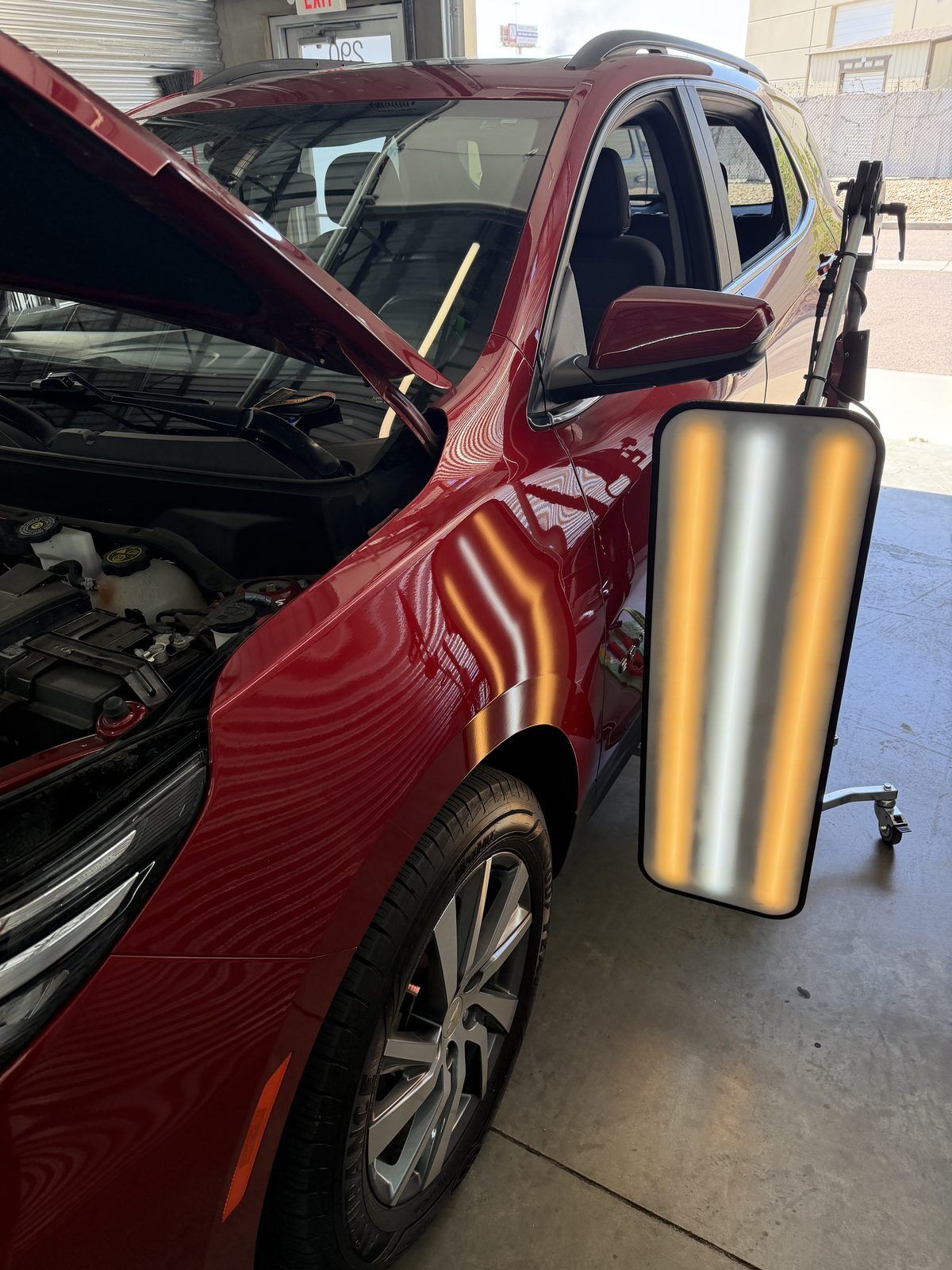 Inside the DFW Paintless Dent Repair workshop in DFW